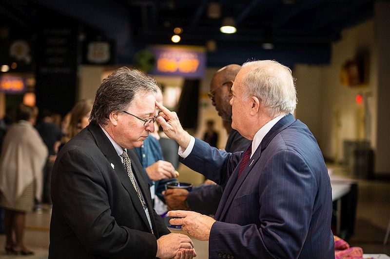 Tom Hudspeth receiving communion